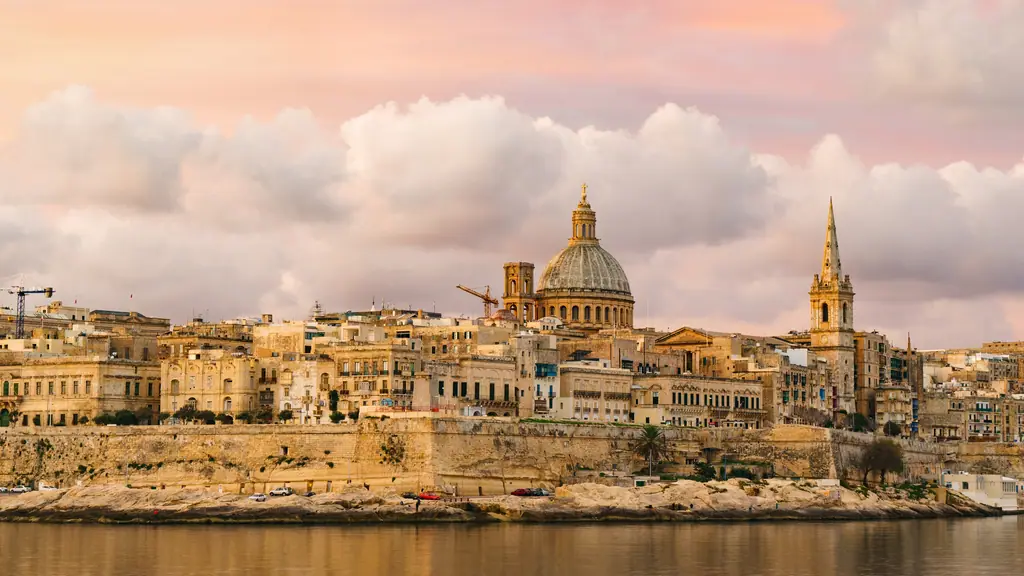 Valletta's skyline at golden hour, with the Carmelite dome and St Paul's spire